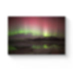 Iceland Red and Green Northern Lights with reflection on ice water