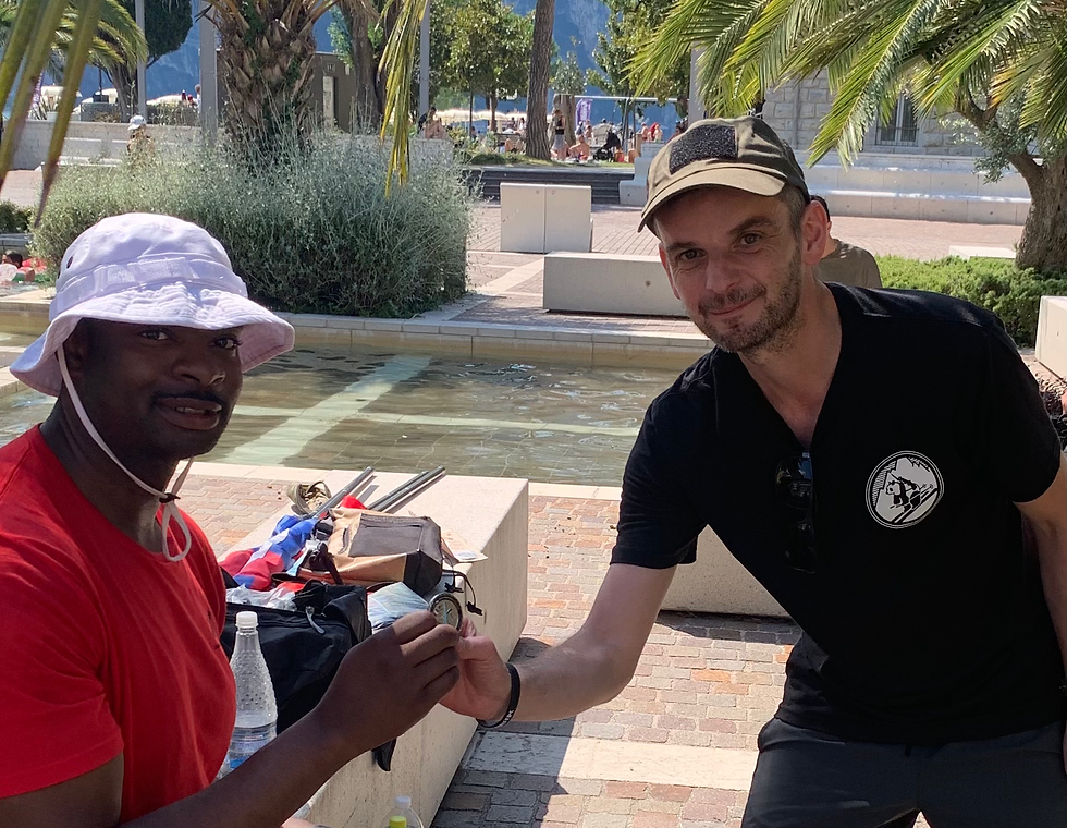 Ben Appleby, president of Association Benàch, presenting Rick Tscherne's 40 Mile Challenge Coin
