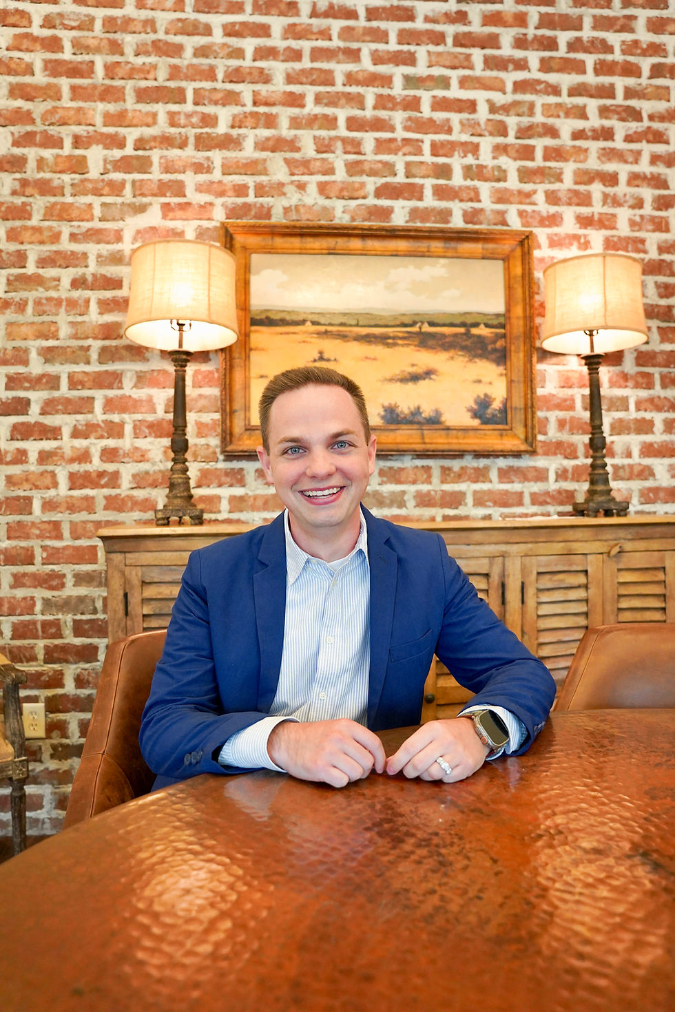 man smiling at table