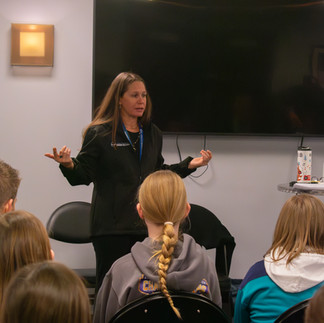 Stefanie Rock giving a nutrition presentation to girls hockey players