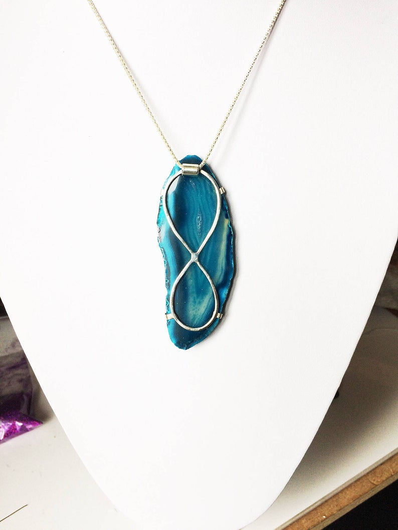 Thumbnail: A Beautiful Blue and Turquiose Polished Agate Slice Pendant