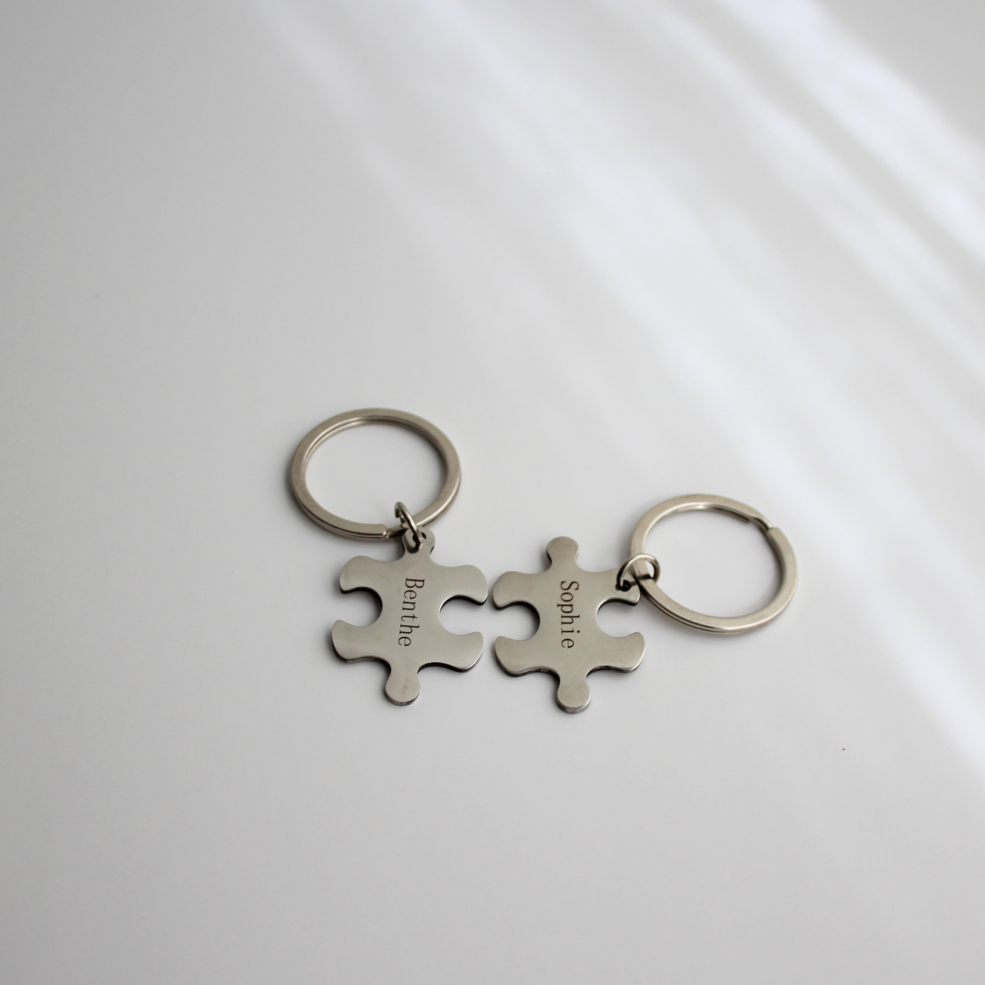Puzzelstuk sleutelhanger met naam (set van 2)