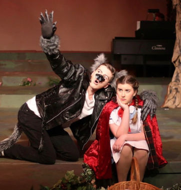 Robyn Emery - Actress
Into the Woods production. Sitting on stage dressed as Little Red with the Big Bad Wolf pointing off to the distance