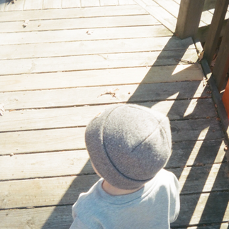 Child playing outdoors captured in a candid family photography style