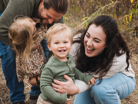 Midwest family smiling during fall photos