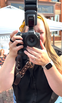 Photographer holding camera in the Midwest