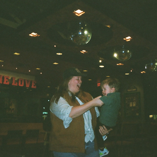 Everyday family moments documented on a Kodak H35 film camera, featuring candid scenes at the grocery store, around the house, and out to eat.