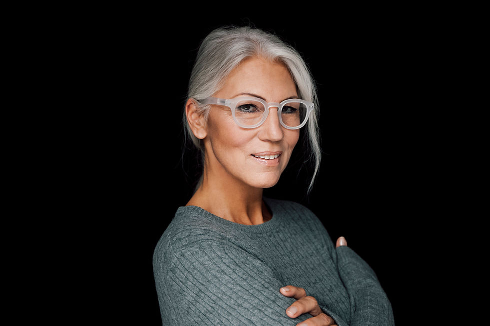 Smiling confident business women portrait with white hair and glasses