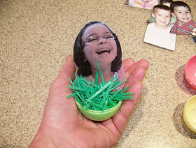 Kidfunideas.com Easter egg kids craft project picture of adding the grass to the egg