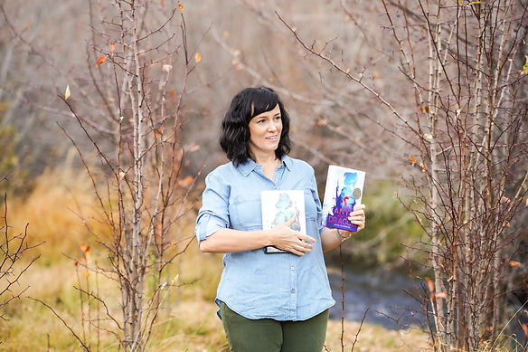 Author holding two books.