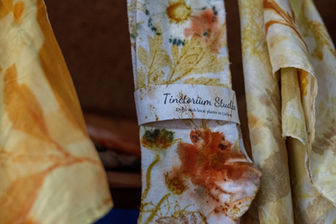 Naturally dyed and eco-printed socks in the Tinctorium Studio showroom