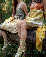 Two mannequins in companion-style outfits with plant-dyed socks at Tinctorium Studio