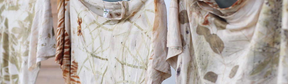 Naturally dyed garments hanging to dry outside Tinctorium Studio
