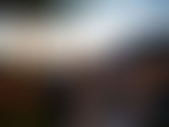 A couple dancing in their backyard patio at dusk