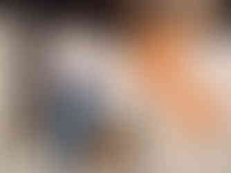 Iris pitching at an event, holding a worksheet from the Alta toolkit in her hands while talking into a microphone