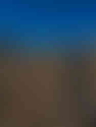 Woman in hiking outfit, looking around at all the rocks