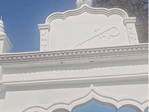 Veena carving into the newly constructed main gate of the Saraswati Mandir