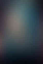 girl looking up in a forest with blue hair