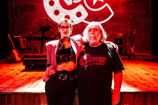 Molly & Sean in front of the Cabaret Vs Cancer stage