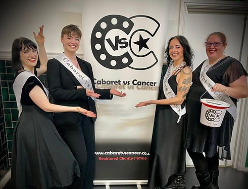 Charity volunteers in front of a CVC banner