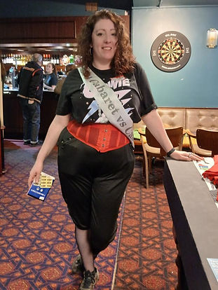 One of our lovely volunteers wearing a Cabaret Vs Cancer sash