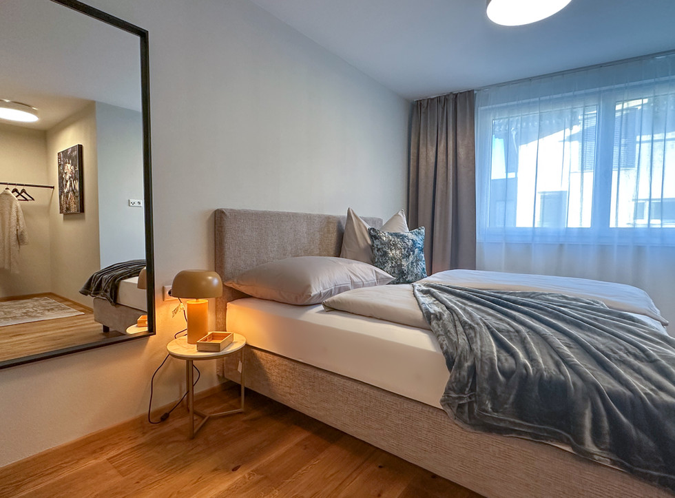 Bedroom in Apartment THREE with double bed, wooden floor and quiet atmosphere