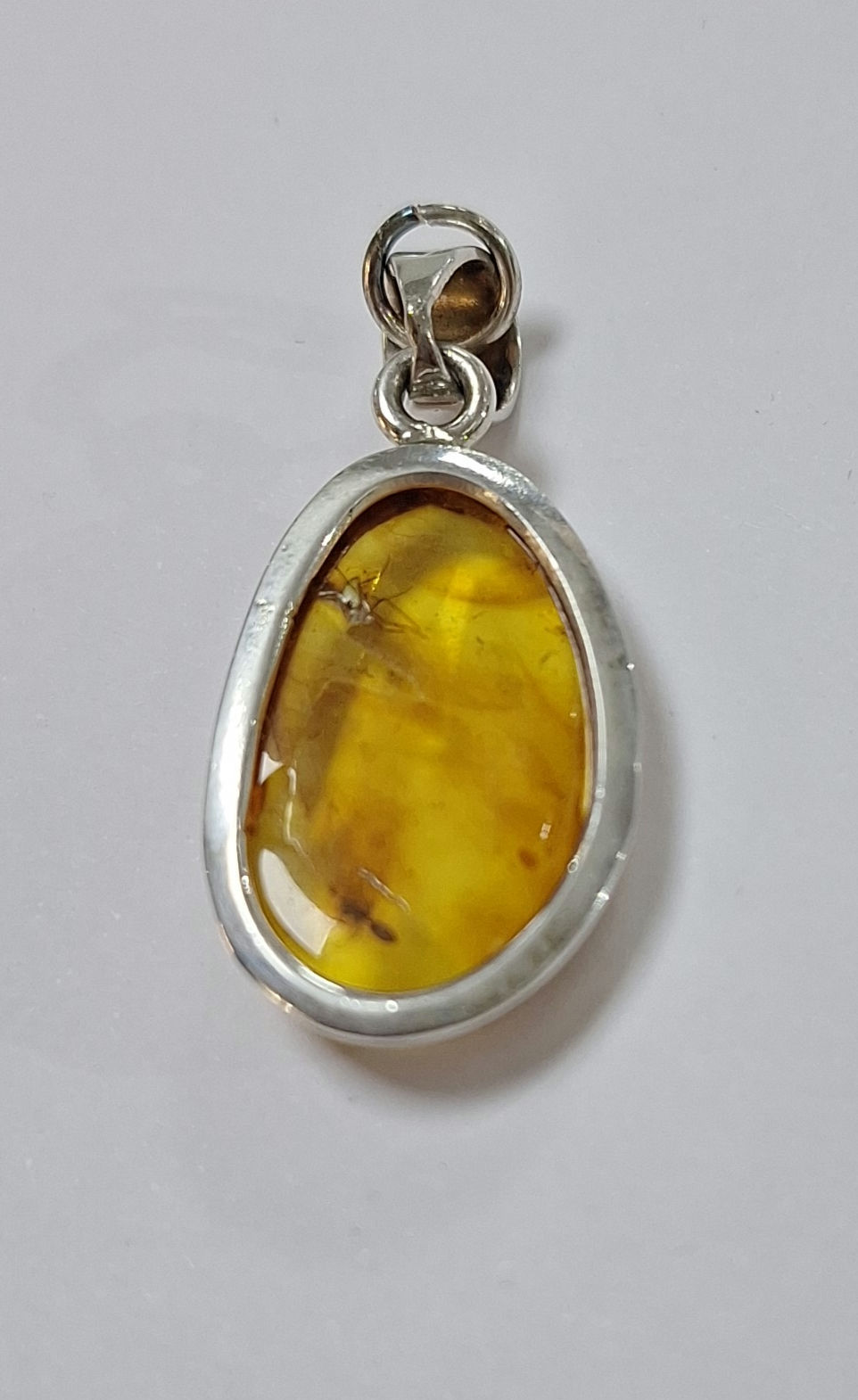 Thumbnail: S67.  Baltic Amber and Sterling Silver pendant with insects 