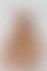 Pretty lady with strapless white top wearing silver necklace and silver bracelet in same style