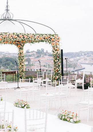 Wedding ceremony setting with decorated canopy and views to the city and Douro river