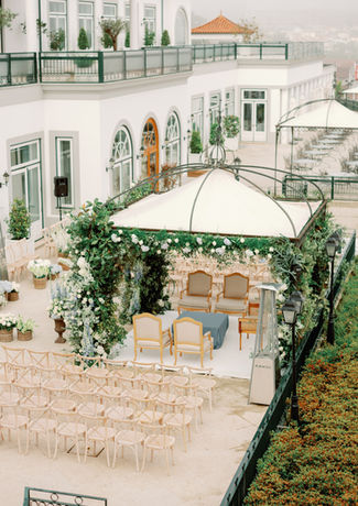 Outdoor wedding ceremony with decorated mandap on the terrace of a hotel
