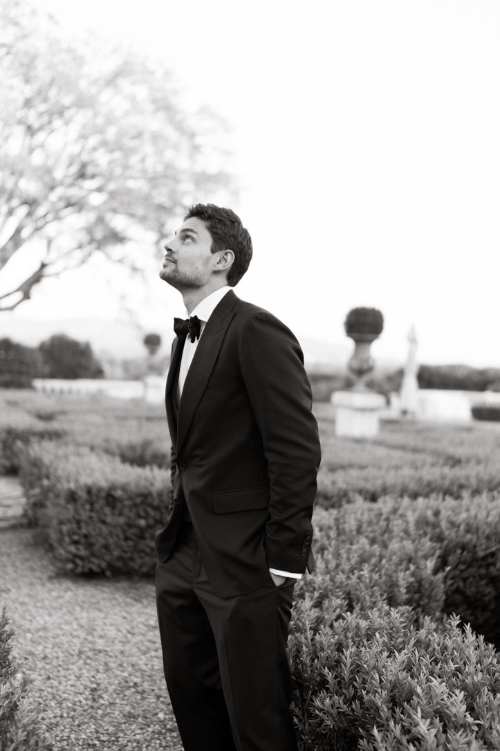 Man dressed in black tuxedo and black bow tie