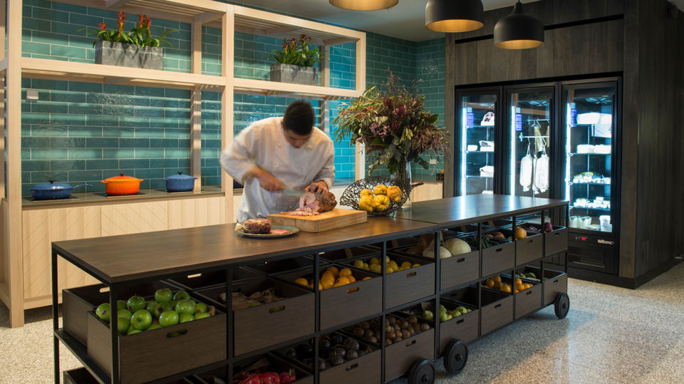 Novotel Barossa The Cellar kitchen by Saskia Beer 

Designed and manufactured by Carmody.

This project was hugely successful by the use of some very bold design elements including a ceiling wallpaper, turquoise tilework and solid onyx stone.
