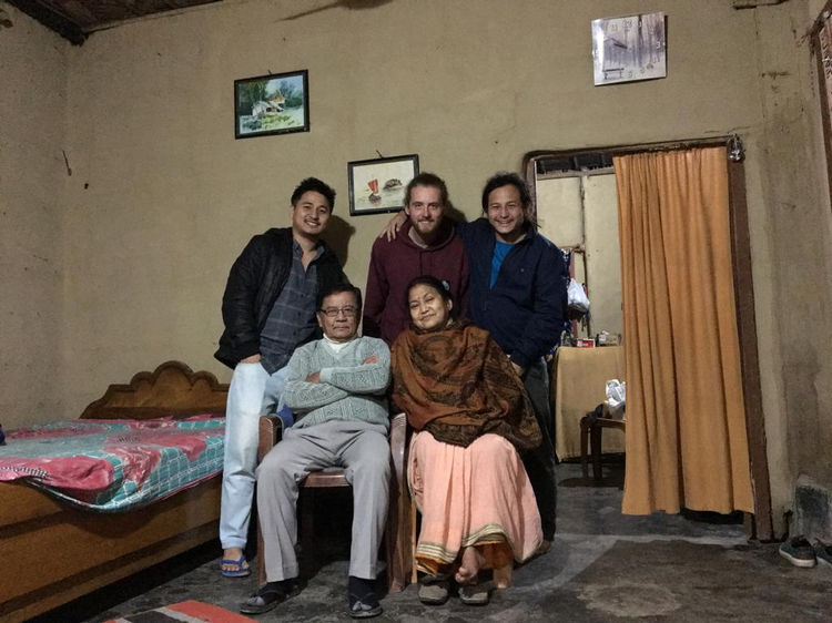 Amit with his parents, younger brother and a friend