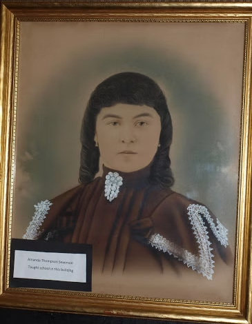Portrait of teacher Amanda Thompson Severson displayed in the Early Schools exhibit at the Roland Museum in Roland Iowa