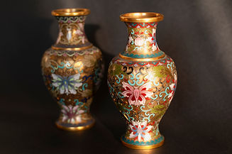 Antique Chinese vase on dark background.