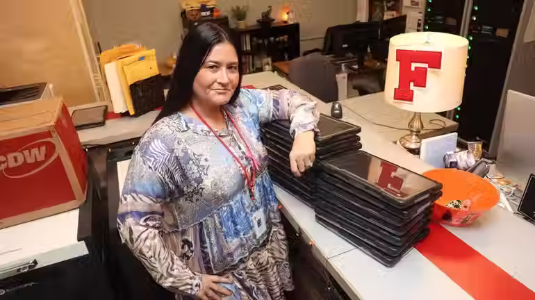 Glori Engel, the assistant superintendent for curriculum and instruction in Freeport schools, in the high school's Chromebook Support Center. The district has accelerated its tech plans, adding computers and providing 750 students with hot spots so they can work at home, she said. Credit: James Carbone