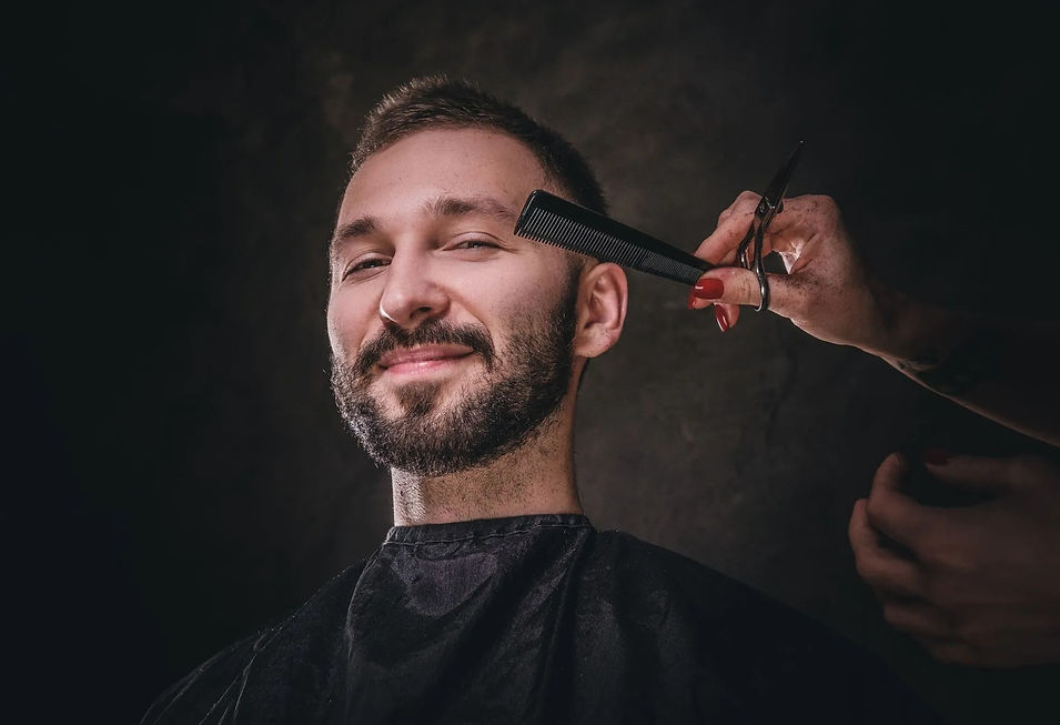 portrait-handsome-male-elite-barbershop-he-gets-facial-hair-care-from-female-2880w.jpg