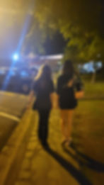 Mikayla and Zoe walking to the park in Jaco for the homeless feeding
