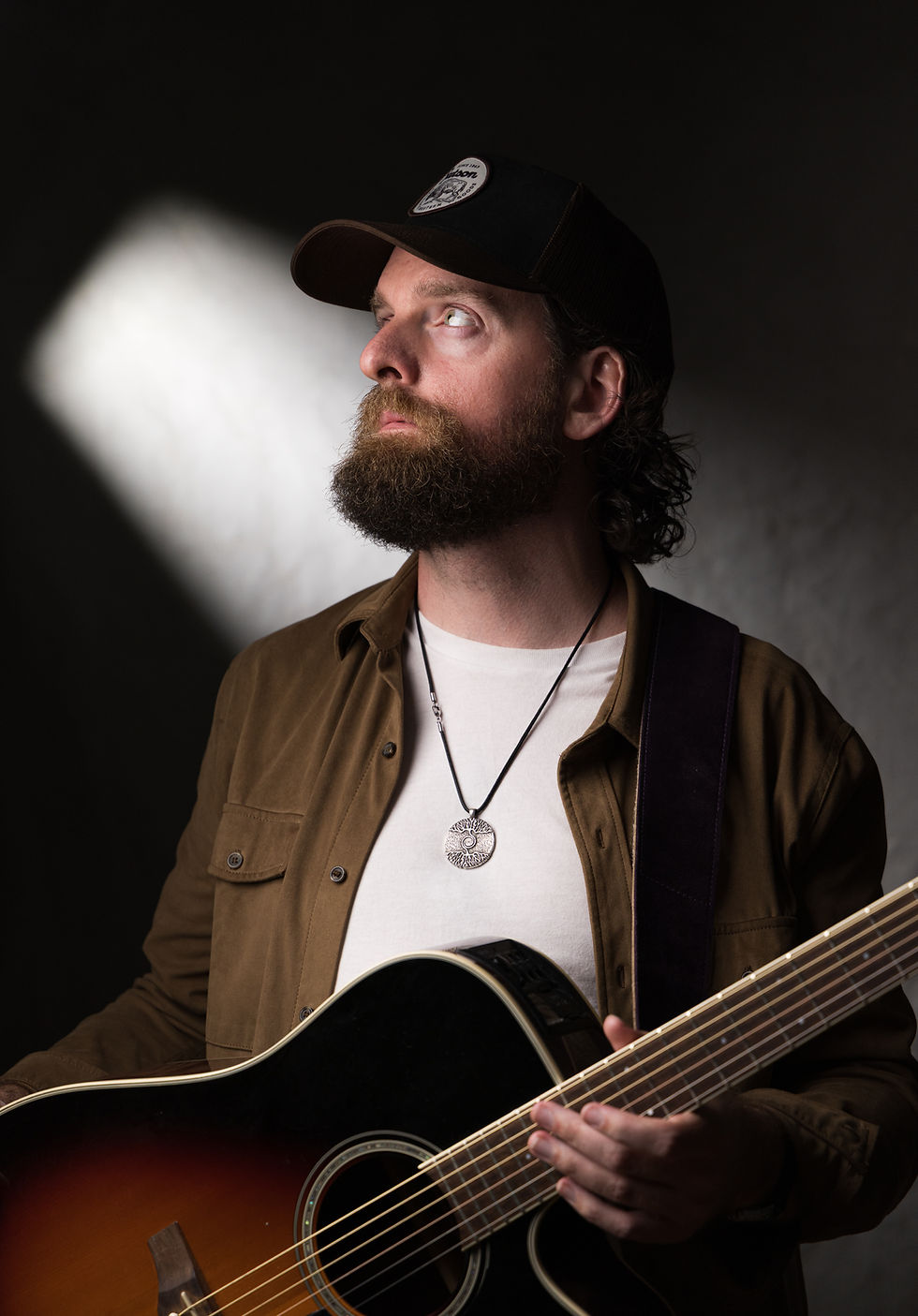 Musician close-up portrait, neutral background, portrait