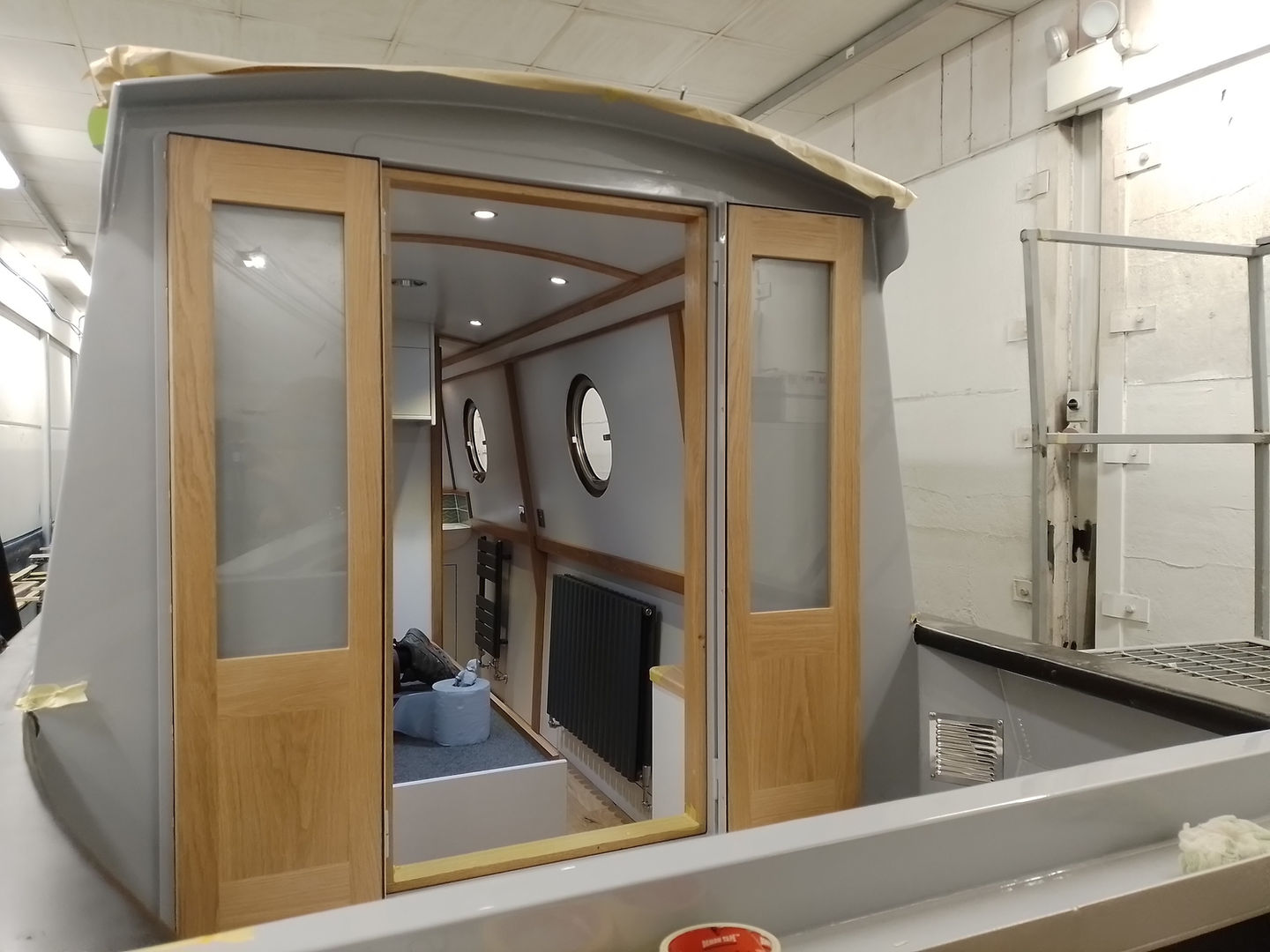 a room with a window and a bottle that says ' sauce ' on it