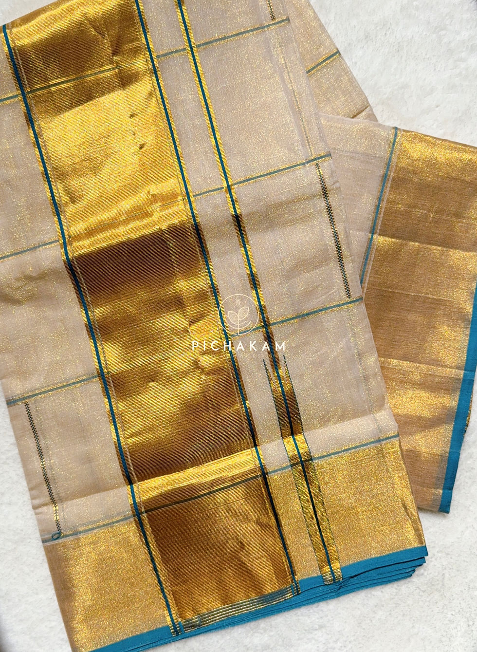 Thumbnail: Pure handwoven Tissue Kasavu saree with a delicate play of understated kattam
