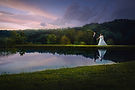A bride and groom walking at The Venue at Carley Brook in Honesdale, PA