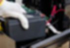 Engineer-installing-new-battery-into-a-UPS-system.jpg