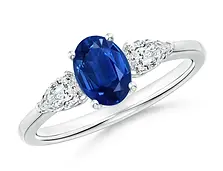 Anillo en oro blanco de zafiro oval natural y diamantes pera