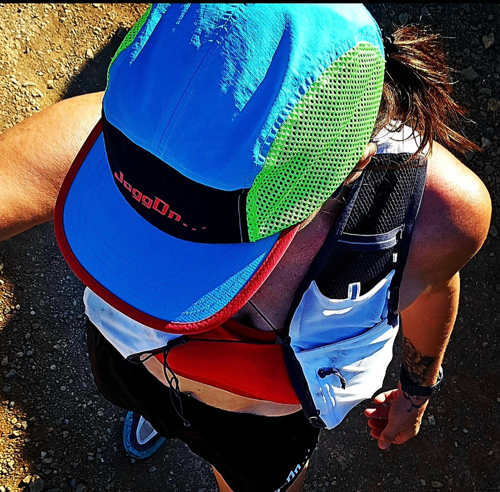 Thumbnail: Runner wearing a blue and green COLOURWAY CAP.