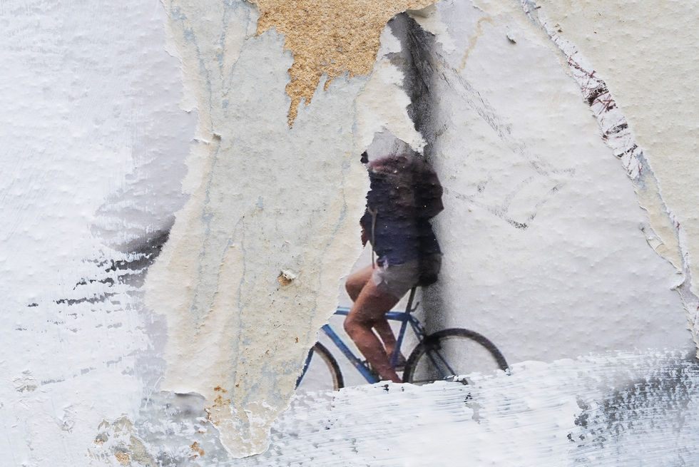 Torn poster of cyclist