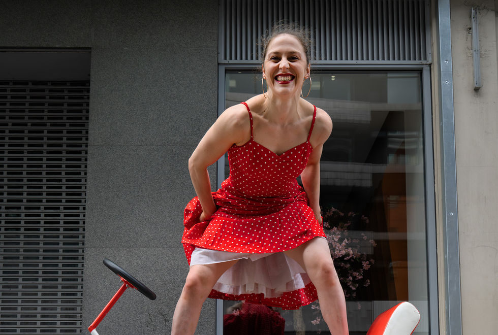 Constanza Ruff standing on a tricycle