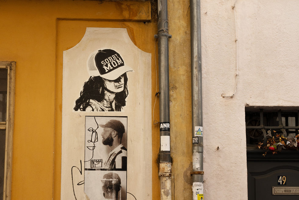 Posters on a yellow wall