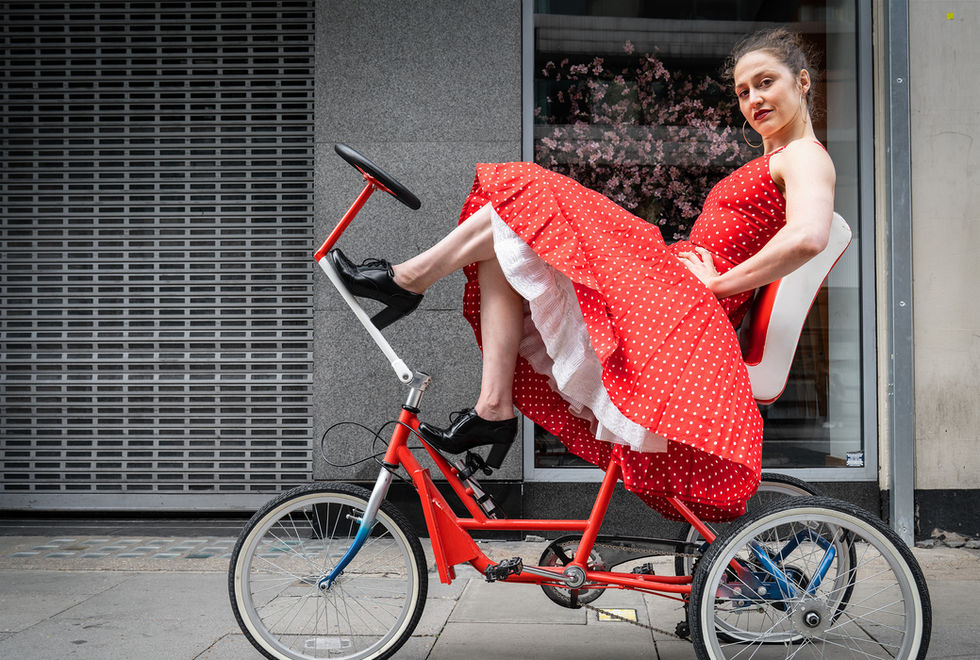 Constanza Ruff on a tricycle