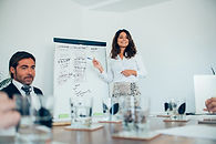 young-businesswoman-giving-presentation.jpg